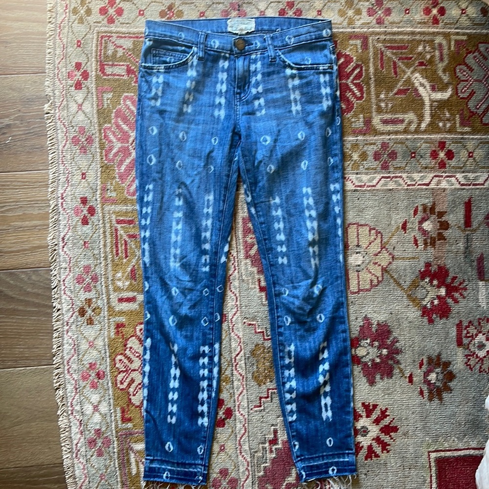 CURRENT/ELLIOTT Aztec print jeans with frayed bottoms.